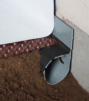 Closeup of a crawl space drainage system installed in Catlettsburg