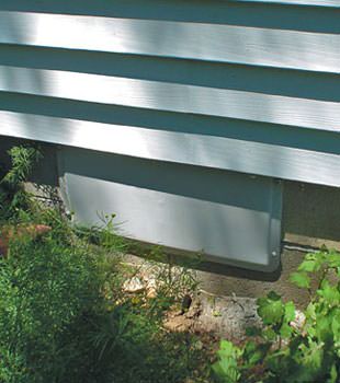 A gray crawl space vent cover in South Point