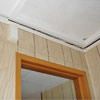 The ceiling and wall separating as the wall sinks with the slab floor in a Olive Hill home