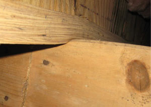 A failing girder showing signs of compression damage in a West Virginia, Kentucky, Ohio home