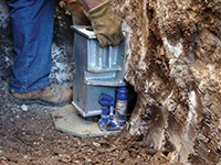 Securing a foundation footing bracket for a foundation repair system in Gallipolis.