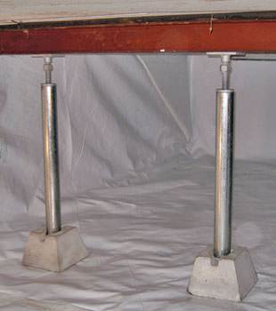 Crawl space jack posts installed in conjunction with a crawl space vapor barrier in Catlettsburg