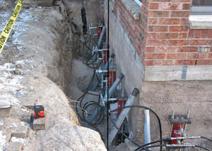 Foundation push piers installed around a house with a foundation settlement issues in Catlettsburg