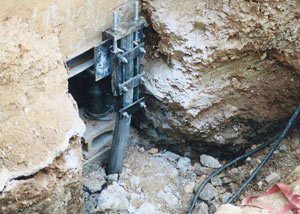 a bent, failed foundation push pier installed in Huntington.
