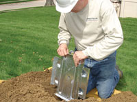 Fastening an earth anchor for a severely bowing wall in Ashland.