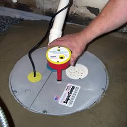 A newly installed sump pump system in a basement in Louisa